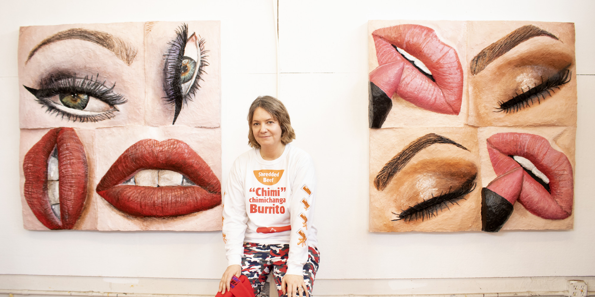 Gina Beavers in her studio with some of her most recent works. From left: Makeup Revolution. 2019. Acrylic and foam on canvas on panel; Makeup Addicts. 2018. Acrylic and foam on canvas on panel. Photo: Ellie Burck