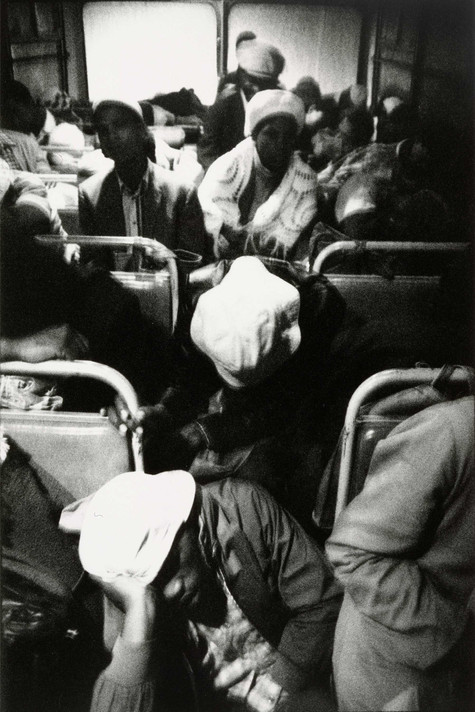 David Goldblatt. The Transported of Kwa Ndebele: Going to Work – 3:30am Wolwekraal-Marabastad Bus, Standing Passengers Have Slumped to the Floor. 1983