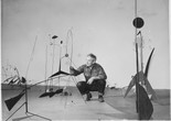 Publicity photograph of Alexander Calder during the installation of Alexander Calder, September 29, 1943–January 16, 1944. 1943. Gelatin silver print, 3 3/4 × 4 3/4″ (9.5 × 12 cm). Photographic Archive, The Museum of Modern Art Archives, New York. © 2021 Calder Foundation, New York/Artists Rights Society (ARS), New York