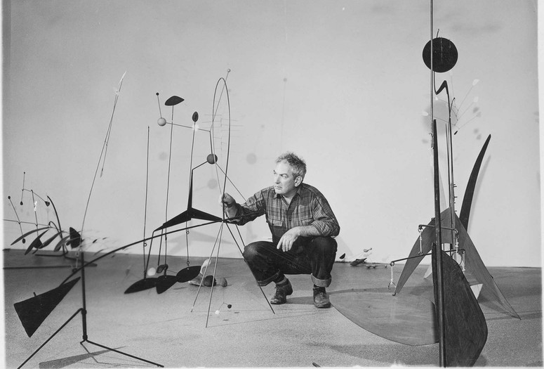 Publicity photograph of Alexander Calder during the installation of Alexander Calder, September 29, 1943–January 16, 1944. 1943. Gelatin silver print, 3 3/4 × 4 3/4″ (9.5 × 12 cm). Photographic Archive, The Museum of Modern Art Archives, New York. © 2021 Calder Foundation, New York/Artists Rights Society (ARS), New York