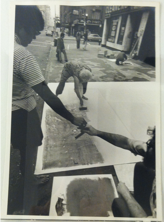 Peter Moore. Photograph of Sari Dienes demonstrating the street rubbing process. 1970