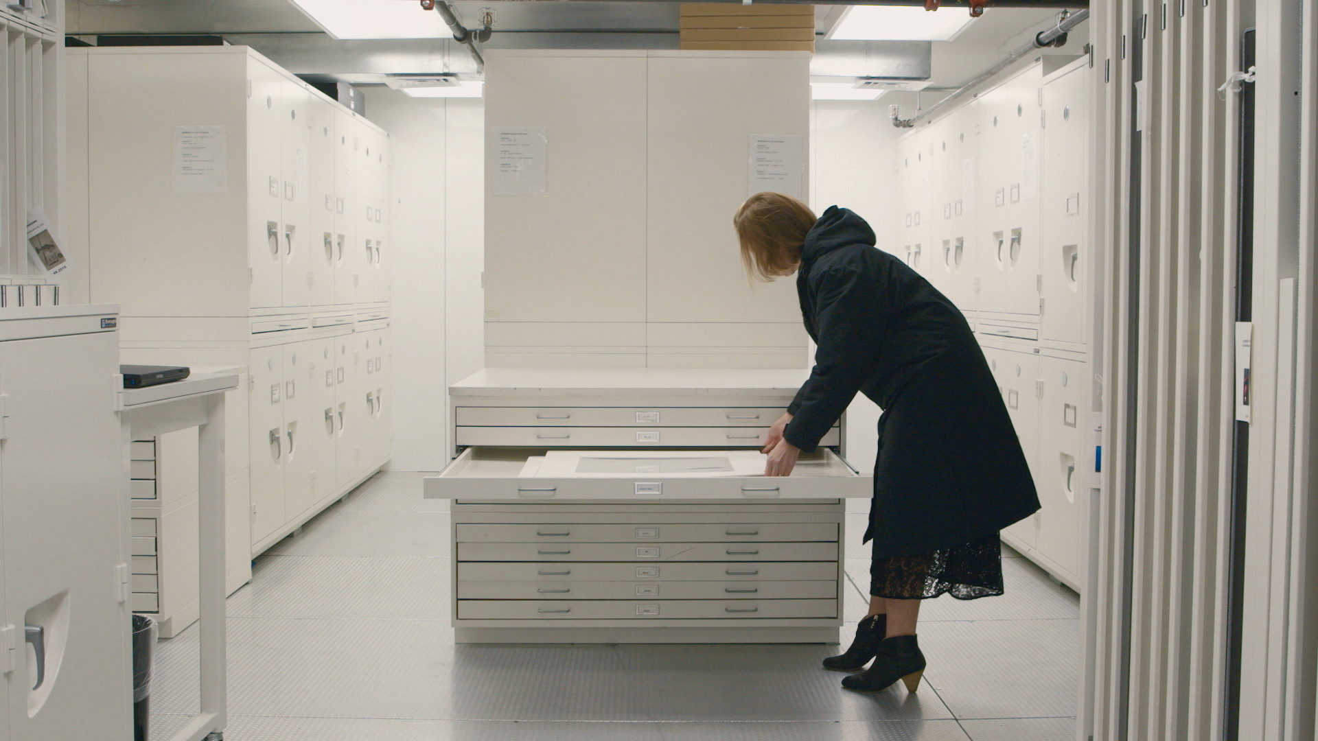Curator Sarah Meister in photography storage, from the course Seeing Through Photographs. © 2019 The Museum of Modern Art